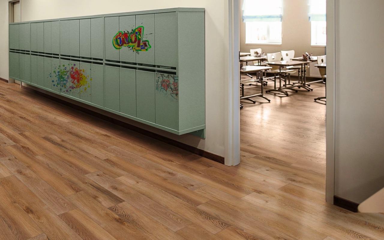 A medium toned durable flooring surface in a classroom setting
